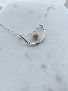 Forged sterling silver wire half moon necklace with peach moonstone