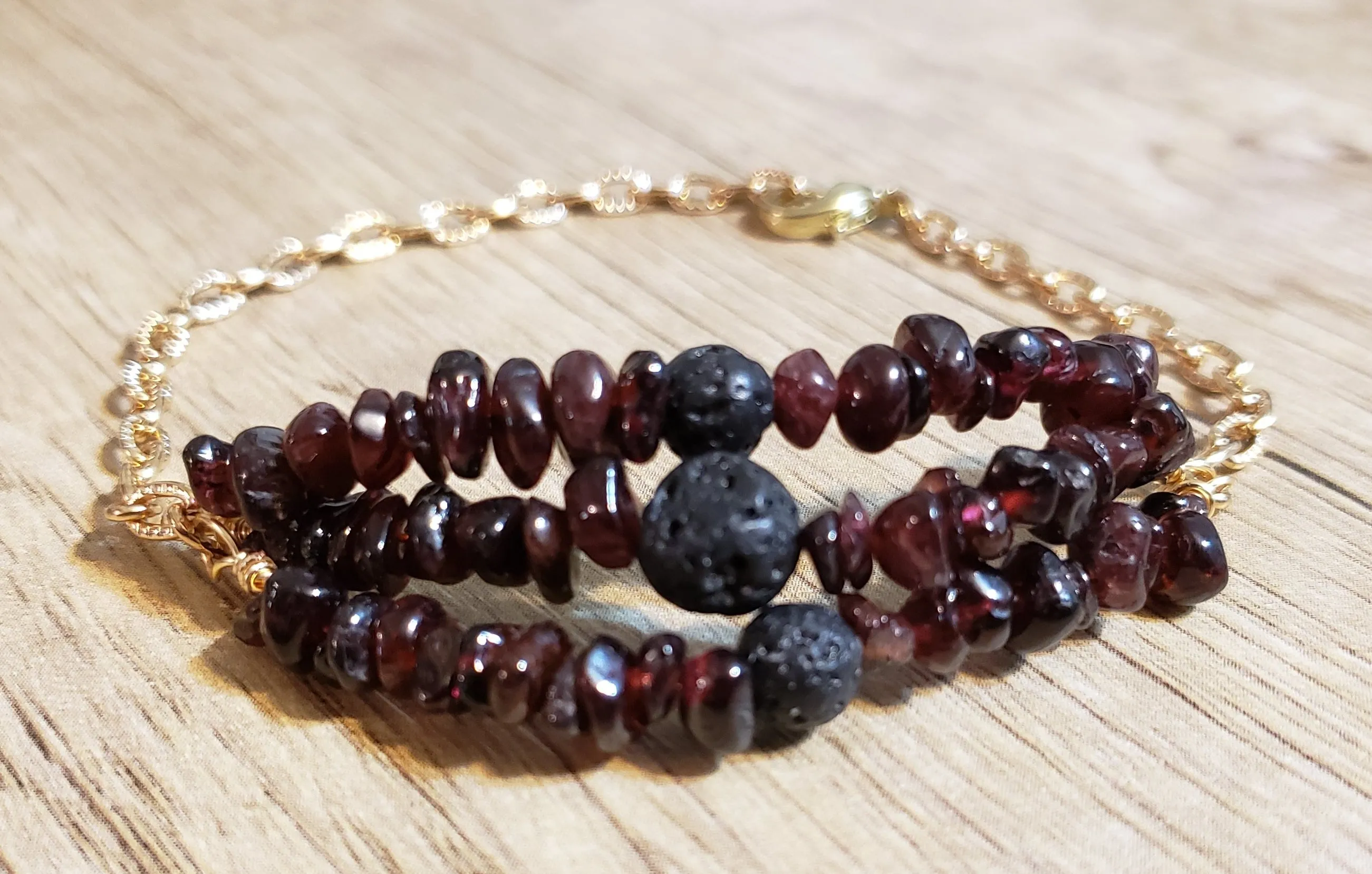 Hand Crafted All Natural, Triple Strand Garnet Gemstone & Gold Tone Chain Bracelet with Lava Rocks. Non Tarnish & Fully Adjustable to 8.5" with Lobster Claw Clasp