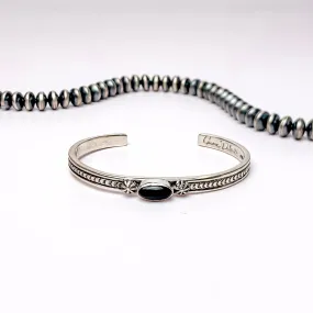 June Delauito | Navajo Handmade Detailed Sterling Silver Cuff with Center Black Onyx Stone